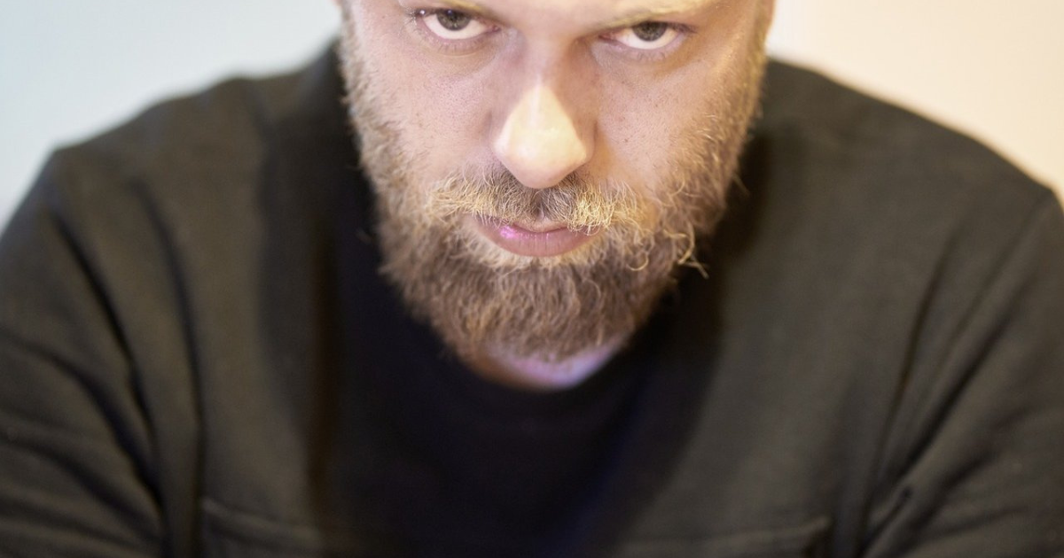 Close up of an annoyed looking man's face